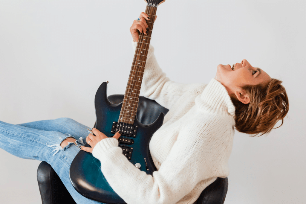 Photo by Karolina Grabowska: https://www.pexels.com/photo/joyful-woman-having-fun-while-practicing-guitar-4471314/