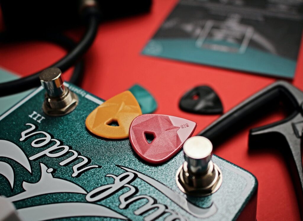 two guitar picks on guitar pedal