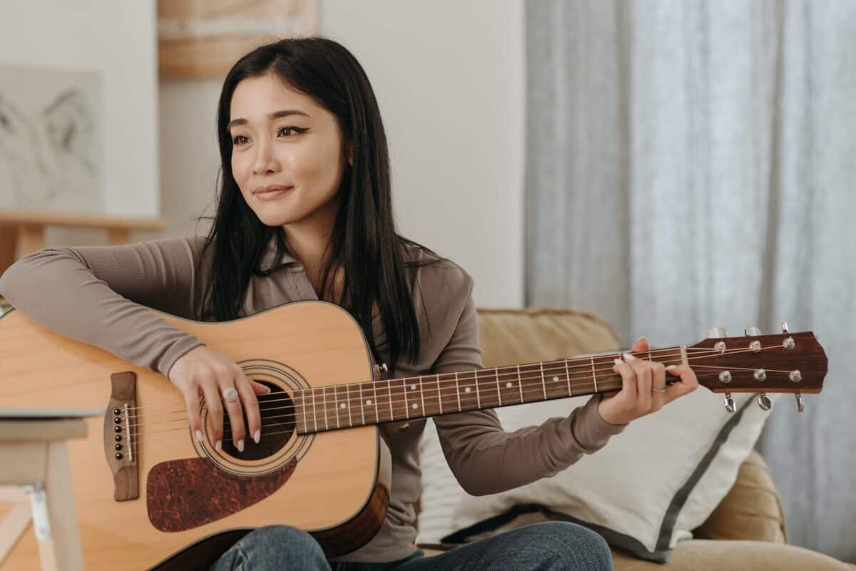 woman playing a guitar