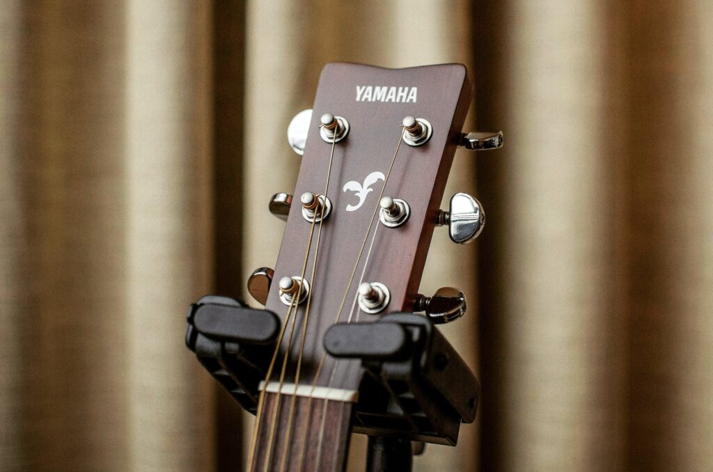 close up photography of a yamaha acoustic guitar