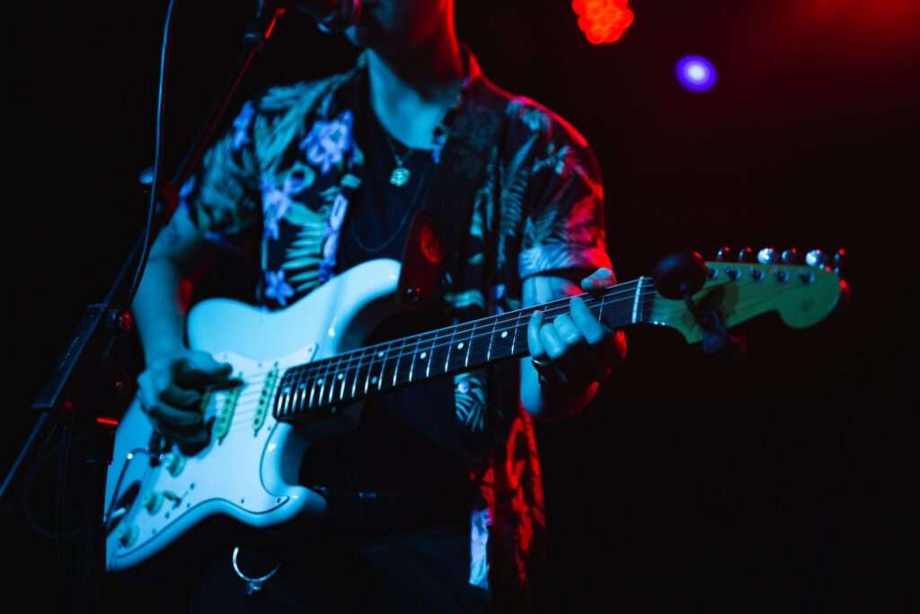 Photo by Wendy Wei: https://www.pexels.com/photo/person-singing-while-playing-electric-guitar-1864637/