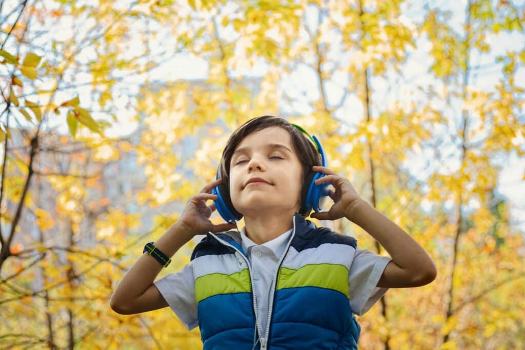 Photo by jonas mohamadi: https://www.pexels.com/photo/photo-of-a-boy-listening-in-headphones-1490844/