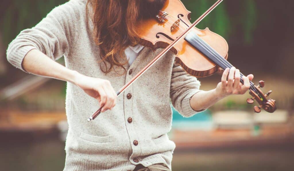 Photo by Clem Onojeghuo: https://www.pexels.com/photo/woman-in-gray-cardigan-playing-a-violin-during-daytime-111287/