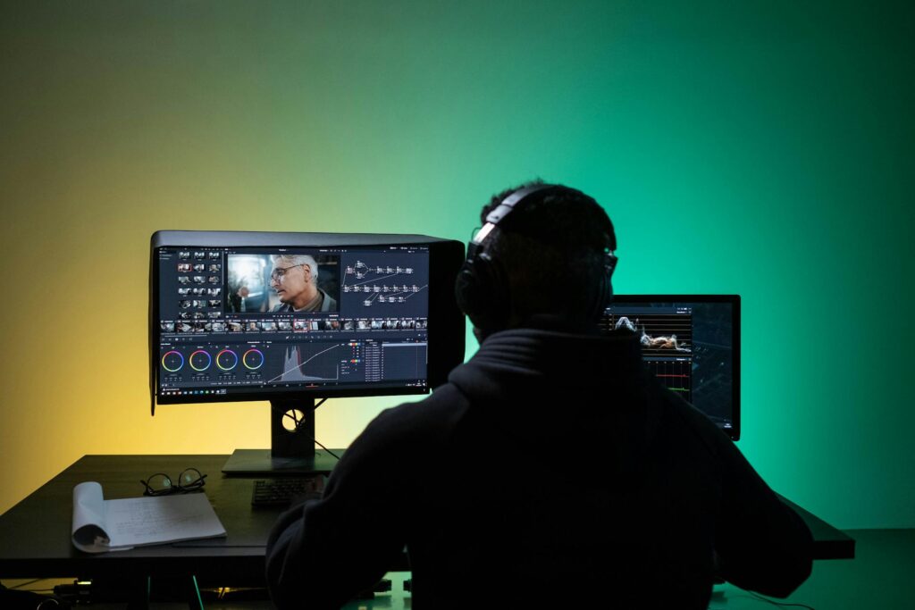 Photo by Ron Lach : https://www.pexels.com/photo/a-man-sitting-on-front-of-the-computer-while-editing-video-8102677/ professional video editing, video editing services, video production, post-production, cinematic editing, visual storytelling, color grading, sound design, video effects, film editing, digital media, content creation, creative editing, motion graphics, video marketing